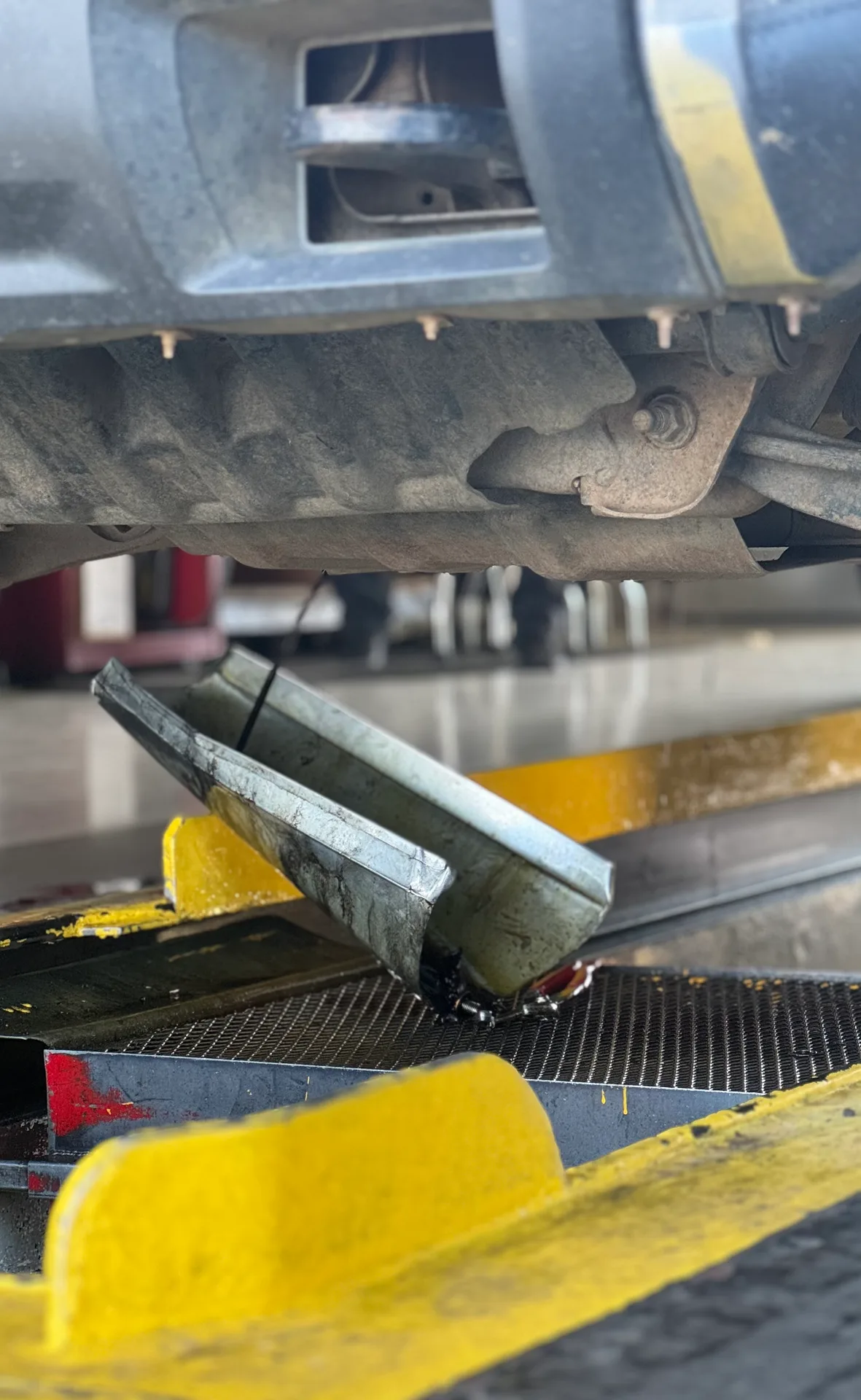 Oil drain view from under a vehicle